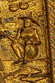 Luang Prabang, Laos - Wat Mai the gilded stucco engravings of the veranda. They narrate the Vessantara Jataka with scenes of everyday life. 